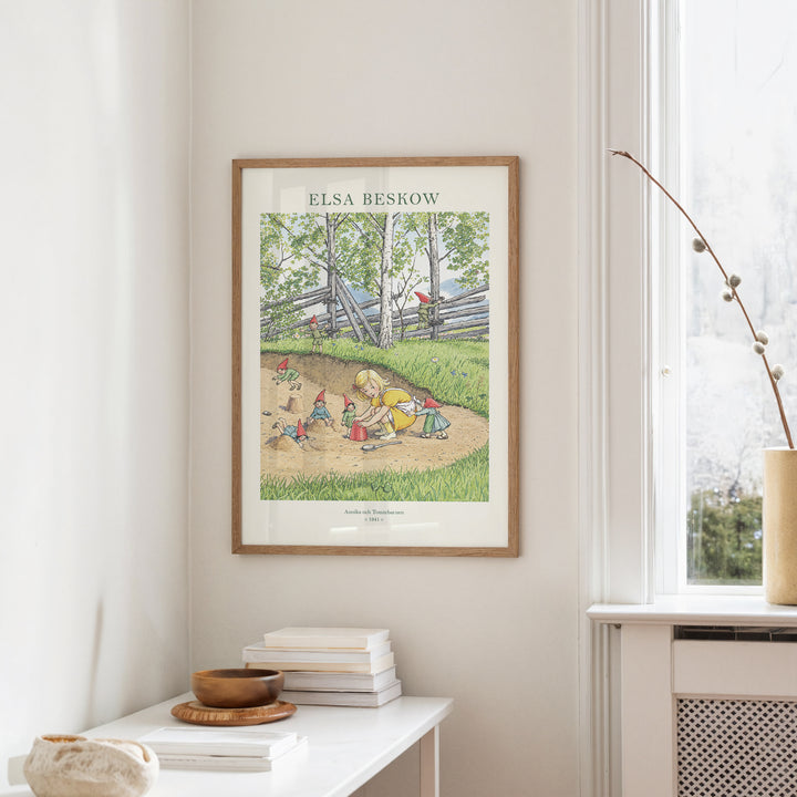 Annika och Tomtebarnen by Elsa Beskow, framed Swedish folklore art print showing tomte children in a cosy woodland scene