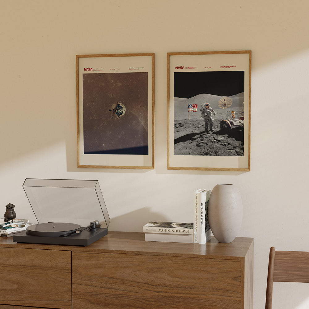 NASA Apollo missions wall art print showing spacecraft above lunar surface, vintage style in deep navy and grey