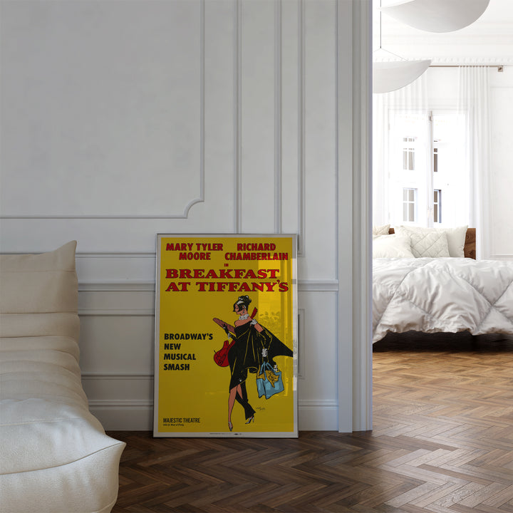 Breakfast at Tiffany's Musical Poster framed art print leaning against white wall in modern living space.