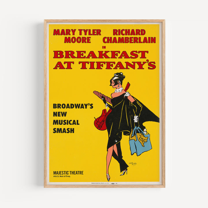 Vintage style art print of a woman in a black dress holding a guitar and bag on the Breakfast at Tiffany's Musical Poster