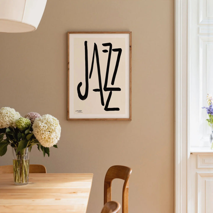 Jazz by Henri Matisse Poster framed on beige wall above wooden table with floral centerpiece and natural light nearby