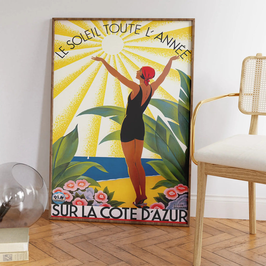 Le Soleil Toute L'Année Poster featuring a vintage-style art print with a woman in a swimsuit and sun rays in yellow, green, and black.