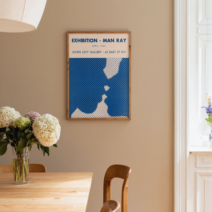 Man Ray Exhibition Poster with minimalist blue and white abstract design, framed art print for wall decor.