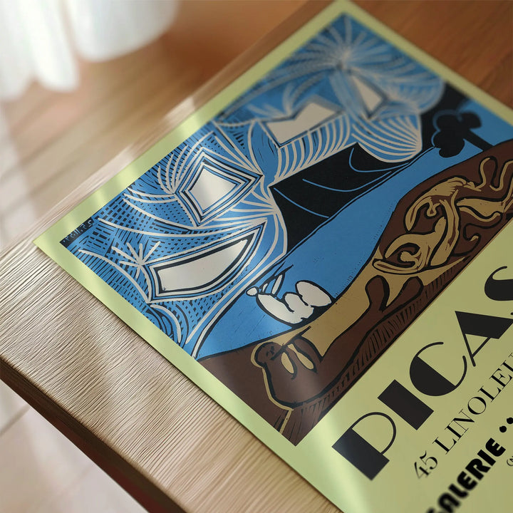 Picasso Cannes Exhibition Poster with abstract blue, black, and beige linocut art style, vintage colors, and poster design.