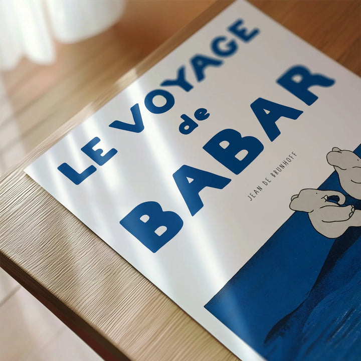 Voyage Babar Poster featuring minimalist blue and white vintage style art print inspired by Jean de Brunhoff's classic design.
