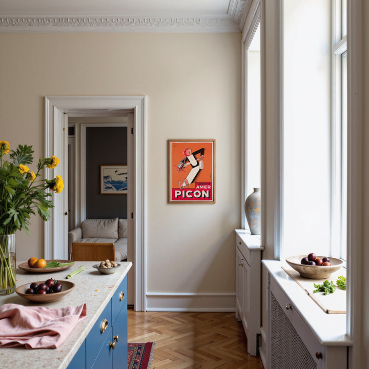 Picon Advertisement Poster vintage style with orange, red, and black colors, framed wall art poster in kitchen setting